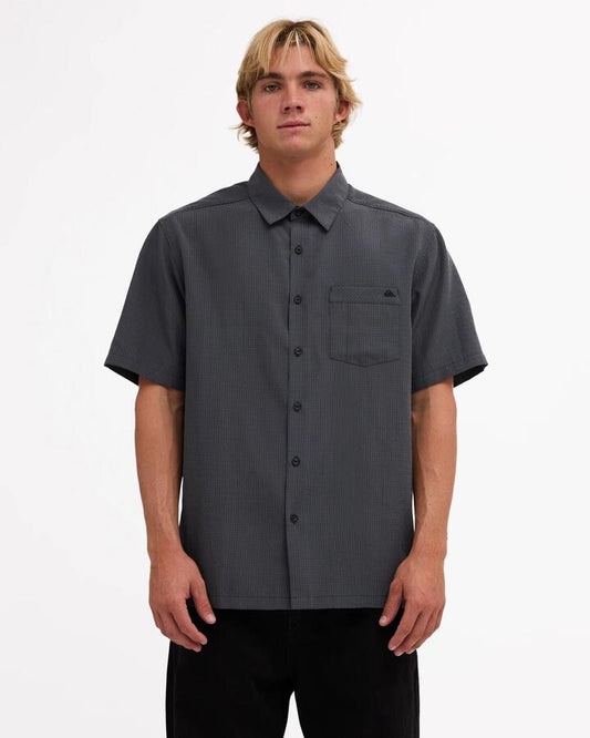 Image of a model wearing Tops. Product name - Quiksilver Mens Centinela Short Sleeve Shirt Iron Gate in Iron Gate colour by brand - Quiksilver