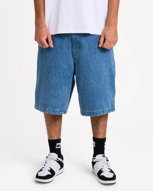 Image of a model wearing Shorts. Product name - Quiksilver Mens Wrench Denim Shorts 2001 Stone Wash in 2001 Stone Wash colour by brand - Quiksilver