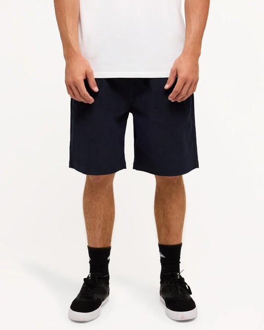 Image of a model wearing Shorts. Product name - Quiksilver Mens Taxer Cord 20" Walkshorts Dark Navy in Dark Navy colour by brand - Quiksilver