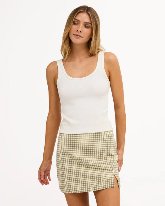 Image of a model wearing Skirts. Product name - Billabong Womens Break Line Mini Skirt Salt Crystal in Salt Crystal colour by brand - Billabong