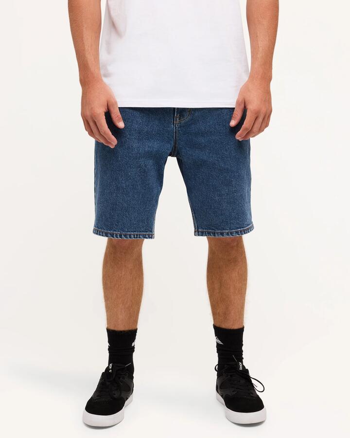 Image of a model wearing Shorts. Product name - Quiksilver Mens Aqua Cult Denim Shorts Aged in Aged colour by brand - Quiksilver