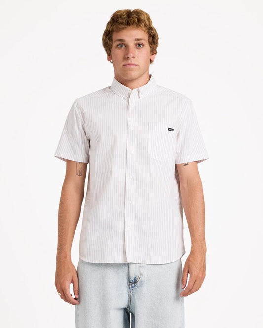 Image of a model wearing Tops. Product name - Rvca Mens Rvca Pinstripe Short Sleeve Shirt Gold in Gold colour by brand - Rvca