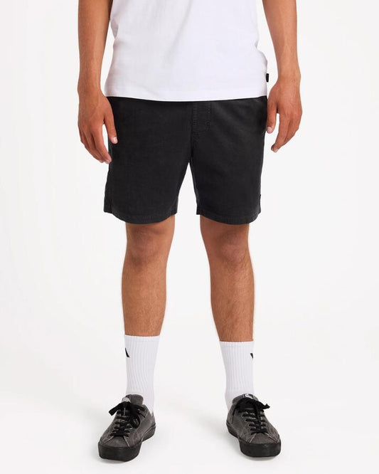 Image of a model wearing Shorts. Product name - Rvca Mens Escape Elastic Cord 17" Elastic Waist Shorts Black in Black colour by brand - Rvca