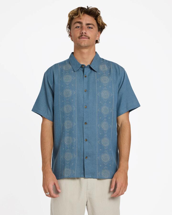 Image of a model wearing Tops. Product name - Billabong Mens Cordoba Short Sleeve Shirt Real Teal in Real Teal colour by brand - Billabong