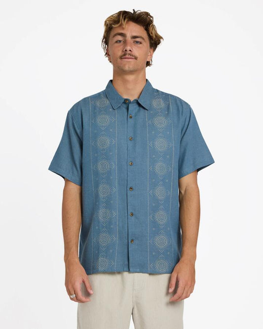Image of a model wearing Tops. Product name - Billabong Mens Cordoba Short Sleeve Shirt Real Teal in Real Teal colour by brand - Billabong