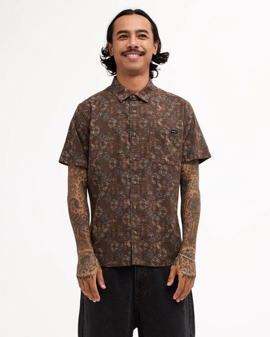 Image of a model wearing Tops. Product name - Rvca Mens Atlantic Short Sleeve Shirt Rvca Black in Rvca Black colour by brand - Rvca