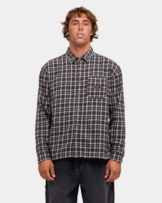 Image of a model wearing Tops. Product name - Billabong Mens Immortal Flannel Long Sleeve Shirt Black in Black colour by brand - Billabong