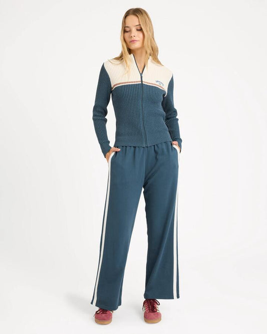 Image of a model wearing Pants. Product name - Billabong Womens Real Since 73 Track Pants Stormy in Stormy colour by brand - Billabong