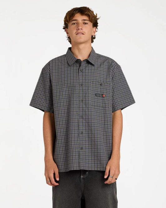 Image of a model wearing Tops. Product name - Billabong Mens Spec Mogul Short Sleeve Shirt Forest in Forest colour by brand - Billabong