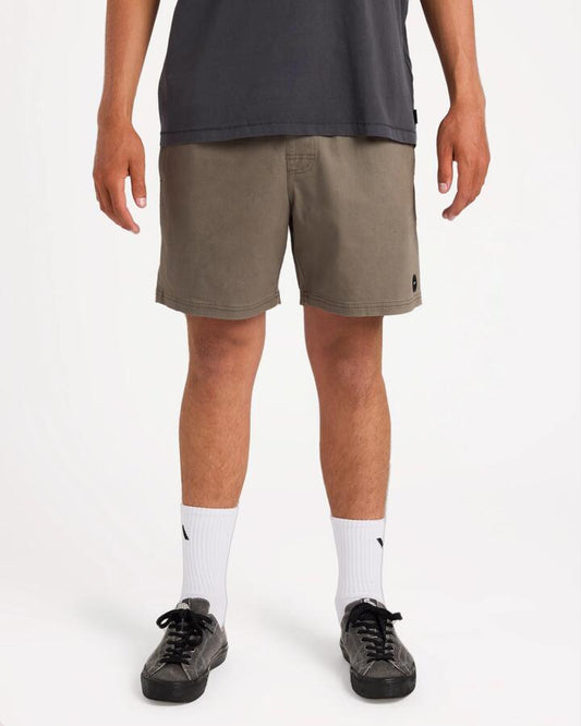 Image of a model wearing Shorts. Product name - Rvca Mens Escape 17" Elastic Waist Shorts Mushroom in Mushroom colour by brand - Rvca