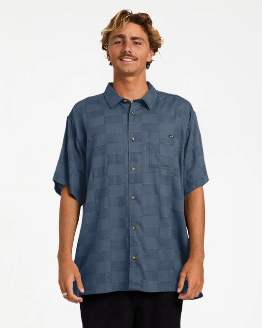 Image of a model wearing Tops. Product name - Billabong Mens Sundays Jacquard Short Sleeve Shirt China Blue in China Blue colour by brand - Billabong