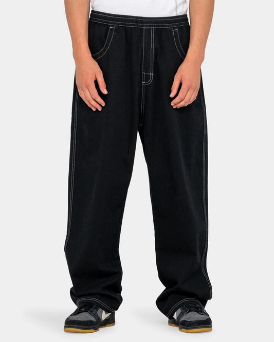 Image of a model wearing Pants. Product name - Rusty Mens Flip Daddy Elastic Waist Pants Black in Black colour by brand - Rusty