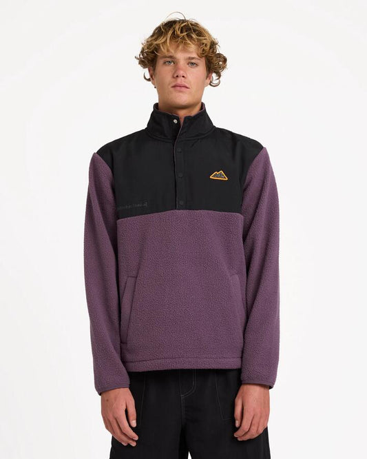 Image of a model wearing Outerwear. Product name - Billabong Mens Boundary Mock Snap Fleece Jumper Vintage Violet in Vintage Violet colour by brand - Billabong