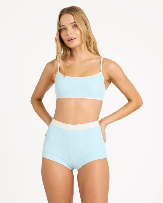 Image of a model wearing Tops. Product name - Billabong Womens Sunrays Mia Dd Bralette Bikini Top Clearwater in Clearwater colour by brand - Billabong