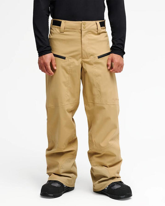 Image of a model wearing Pants. Product name - Quiksilver Mens Paramo Stretch 20K Snow Pants Kelp in Kelp colour by brand - Quiksilver