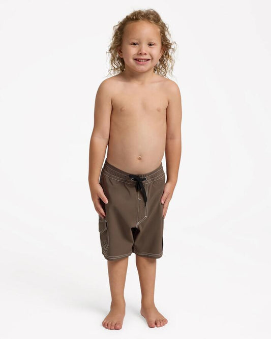 Image of a model wearing Shorts. Product name - Quiksilver Boys 2-7 Exhibit 13" Volley Shorts Canteen in Canteen colour by brand - Quiksilver