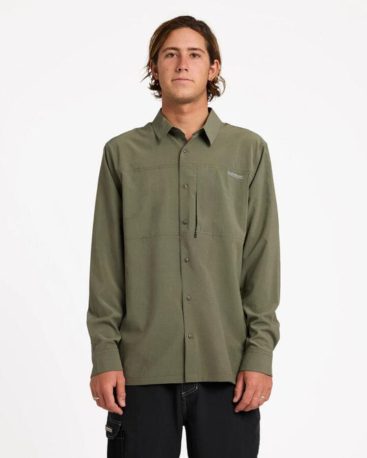 Image of a model wearing Tops. Product name - Quiksilver Mens Longline Performance Long Sleeve Shirt Dusty Olive in Dusty Olive colour by brand - Quiksilver