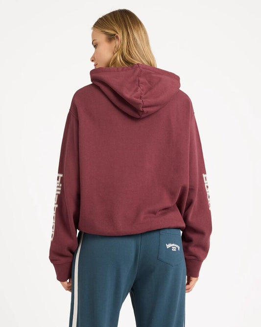 Image of a model wearing Outerwear. Product name - Billabong Womens Easy Waves Pullover Hoodie Deep Red in Deep Red colour by brand - Billabong