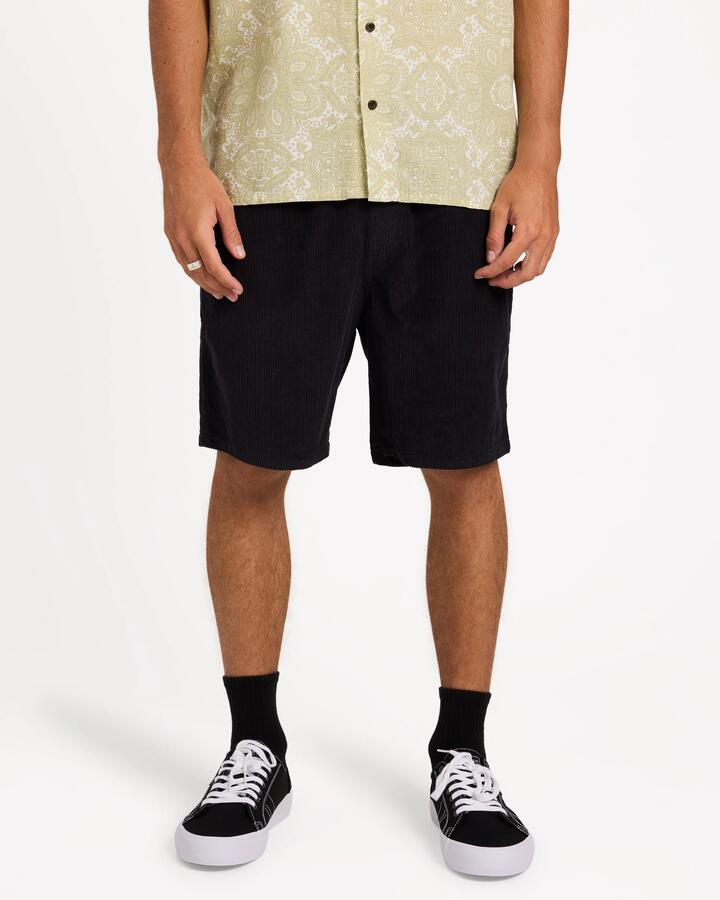Image of a model wearing Shorts. Product name - Billabong Mens Larry Cord Walkshorts Char in Char colour by brand - Billabong