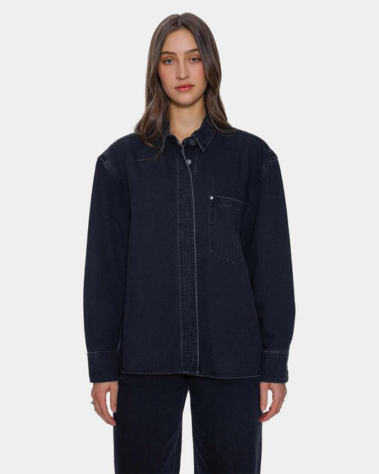 Image of a model wearing Tops. Product name - Thrills Womens Melina Oversized Denim Long Sleeve Shirt Aged Black in Aged Black colour by brand - Thrills