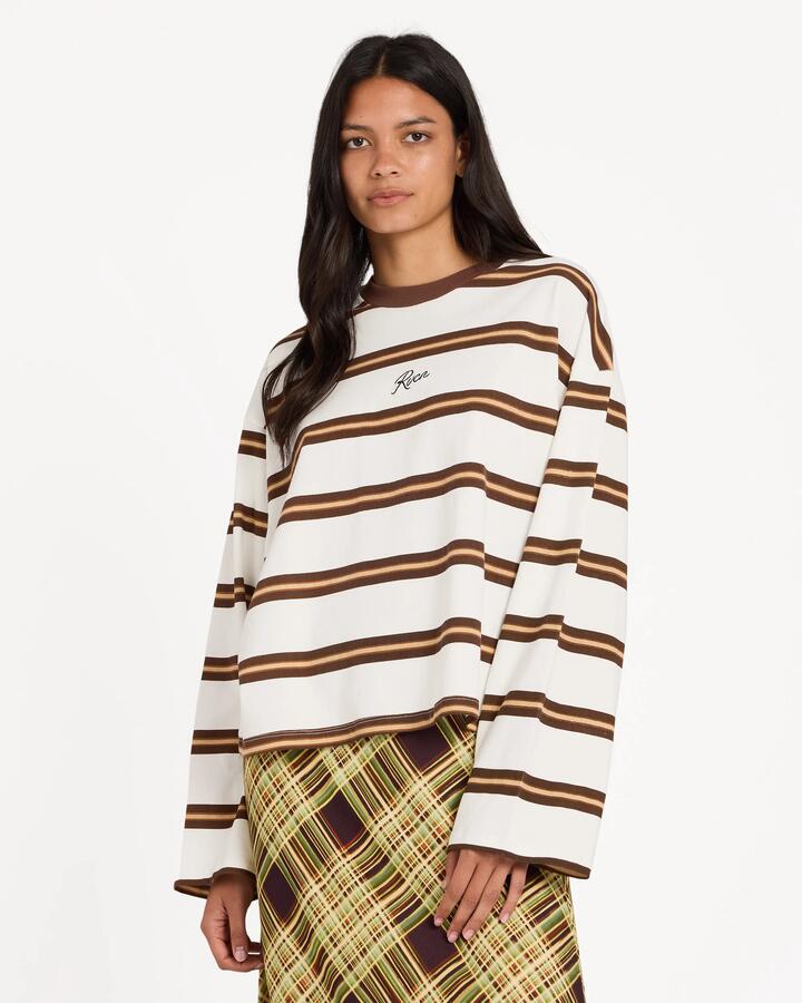Image of a model wearing Tops. Product name - Rvca Womens Berkley Long Sleeve Stripe T-Shirt Cloud in Cloud colour by brand - Rvca