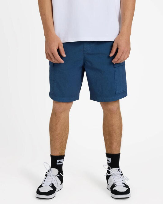 Image of a model wearing Shorts. Product name - Quiksilver Mens Taxer Surfwash Amphibian 19" Hybrid Shorts Dark Denim in Dark Denim colour by brand - Quiksilver