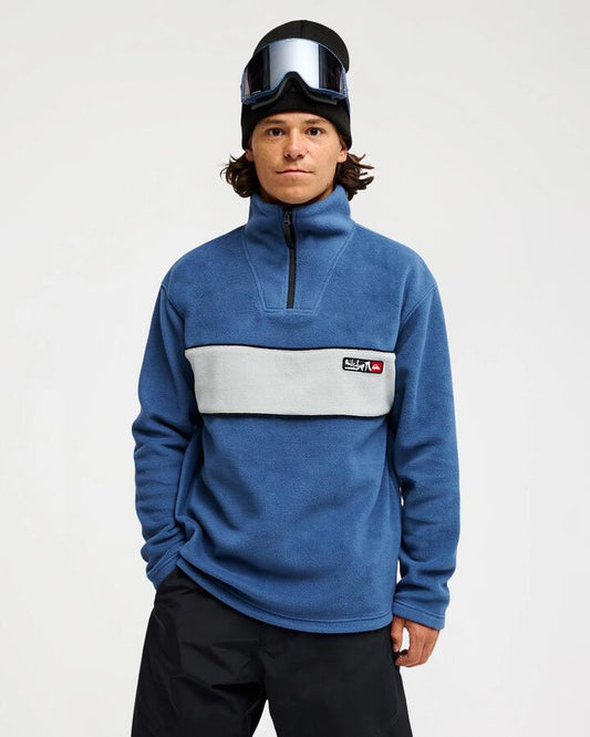 Image of a model wearing Outerwear. Product name - Quiksilver Mens Yg Cruz Polar Half Zip Fleece Dark Denim in Dark Denim colour by brand - Quiksilver