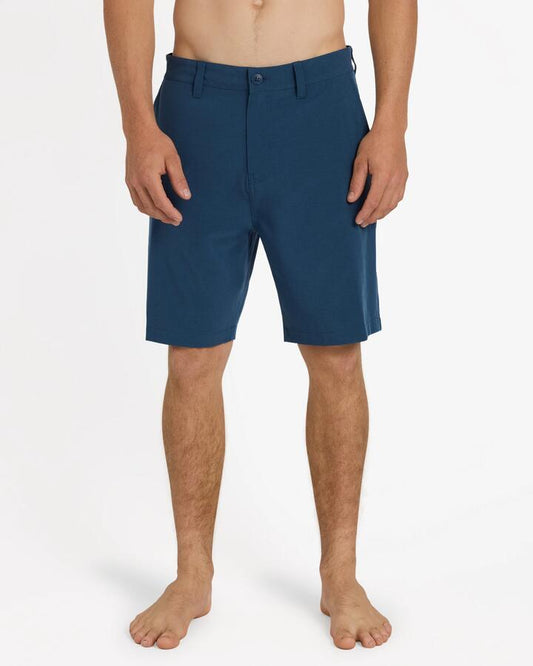 Image of a model wearing Shorts. Product name - Quiksilver Mens Union Heather Amph 19" Hybrid Shorts Dark Denim in Dark Denim colour by brand - Quiksilver
