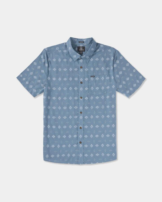 Image of a model wearing Tops. Product name - Volcom Mens Trusted Short Sleeve Shirt Blue Wash in Blue Wash colour by brand - Volcom