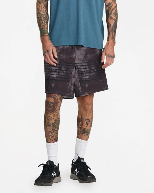 Image of a model wearing Shorts. Product name - Rvca Mens Yogger Stretch 17" Sports Shorts Balsam Green in Balsam Green colour by brand - Rvca