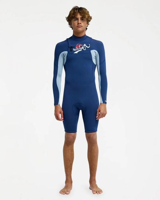 Image of a model wearing Tops. Product name - Quiksilver Mens Young Guns 2/2Mm Full Zip Long Sleeve Springsuit Dark Denim in Dark Denim colour by brand - Quiksilver