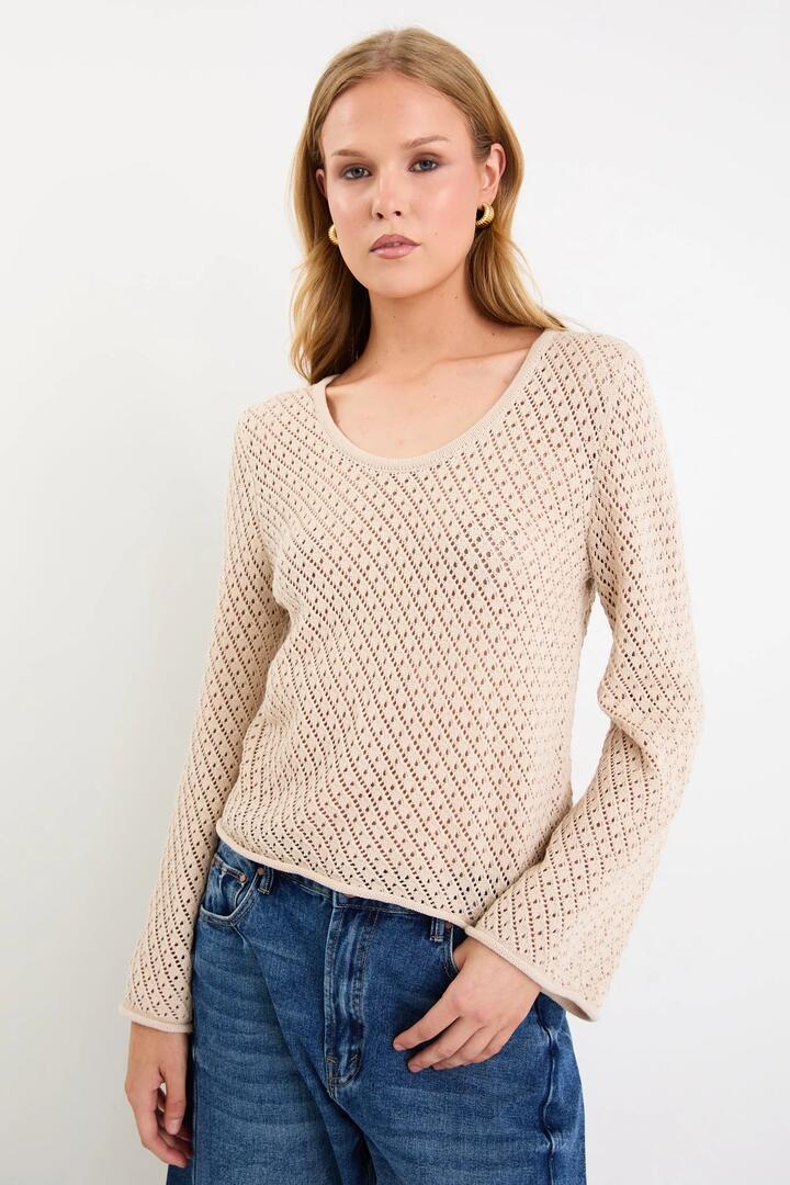 Image of a model wearing Outerwear. Product name - Aurora String Scoop Neck Crochet Knit Jumper in String colour by brand - Ivy + Jack