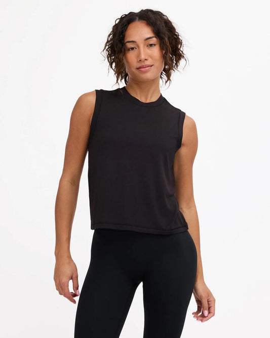 Image of a model wearing Tops. Product name - Rvca Womens Rvca Muscle Tank Top Rvca Black in Rvca Black colour by brand - Rvca