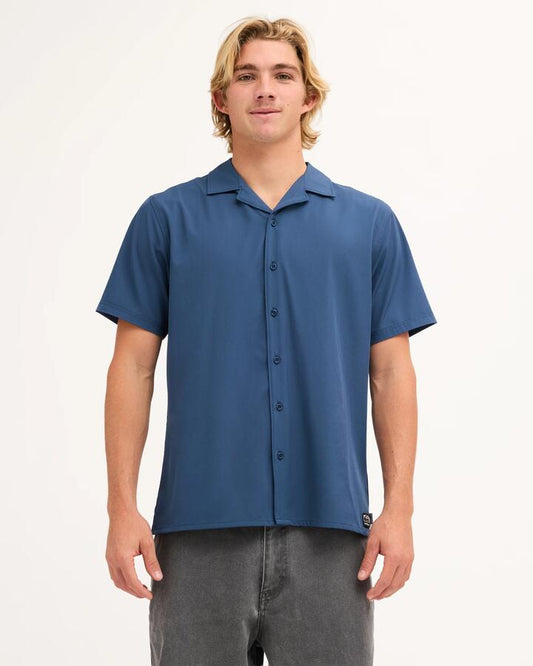 Image of a model wearing Tops. Product name - Quiksilver Mens Sunbelt Short Sleeve Shirt Dark Denim in Dark Denim colour by brand - Quiksilver