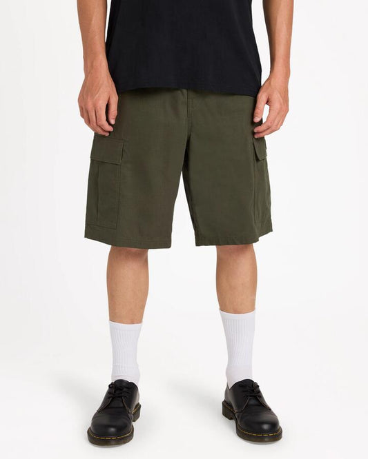 Image of a model wearing Shorts. Product name - Volcom Mens Tripper Cargo Shorts Squadron Green in Squadron Green colour by brand - Volcom