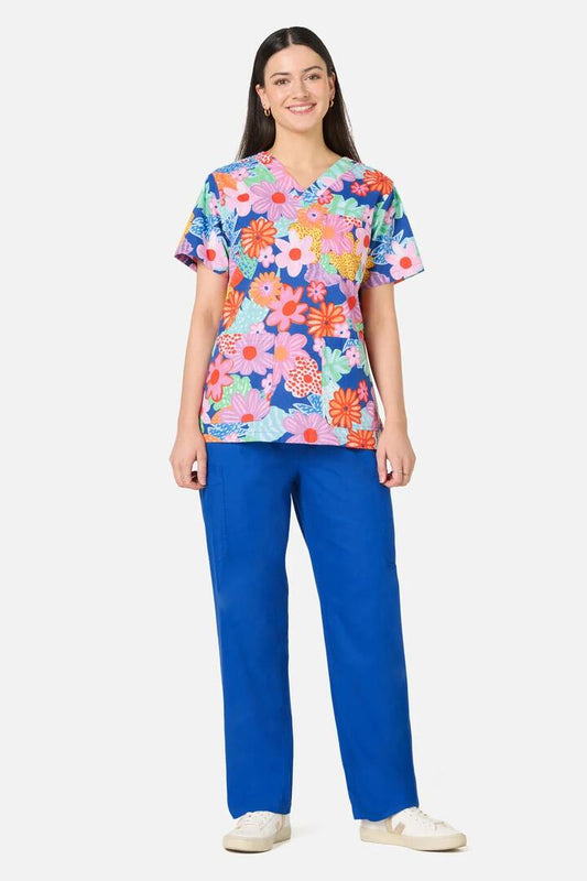Image of a model wearing Uniforms & Workwear. Product name - Polka Floral Top & Pant Scrub Set in Multi colour by brand - Gorman