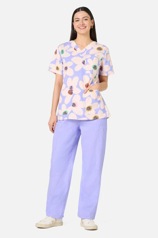 Image of a model wearing Uniforms & Workwear. Product name - Daisy Scrub Top & Pant Set in Lilac colour by brand - Gorman