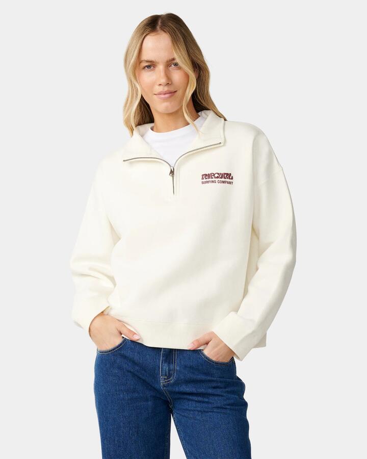 Image of a model wearing Outerwear. Product name - Rip Curl Womens Surf Puff 1/4 Zip Jumper Bone in Bone colour by brand - Rip Curl