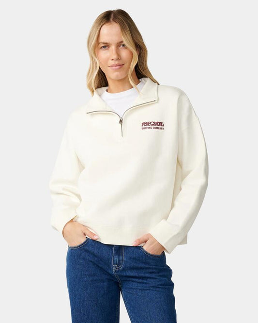 Image of a model wearing Outerwear. Product name - Rip Curl Womens Surf Puff 1/4 Zip Jumper Bone in Bone colour by brand - Rip Curl