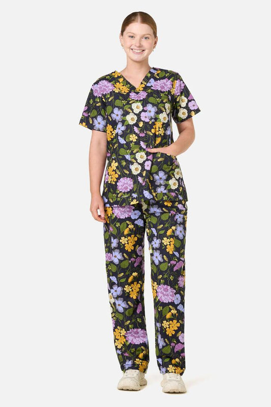 Image of a model wearing Uniforms & Workwear. Product name - Grasshopper Scrub Set in Navy colour by brand - Scrubs With Love