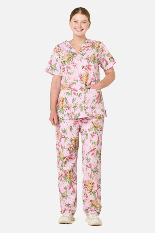 Image of a model wearing Uniforms & Workwear. Product name - Native Koala Scrub Set Pink in Pink colour by brand - Scrubs With Love