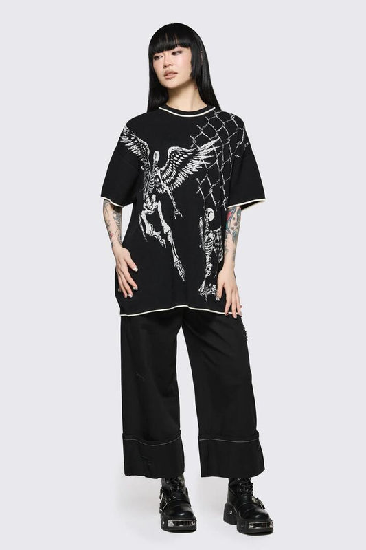 Image of a model wearing Outerwear. Product name - Archangel Oversize Knit Jumper in Black colour by brand - Dangerfield