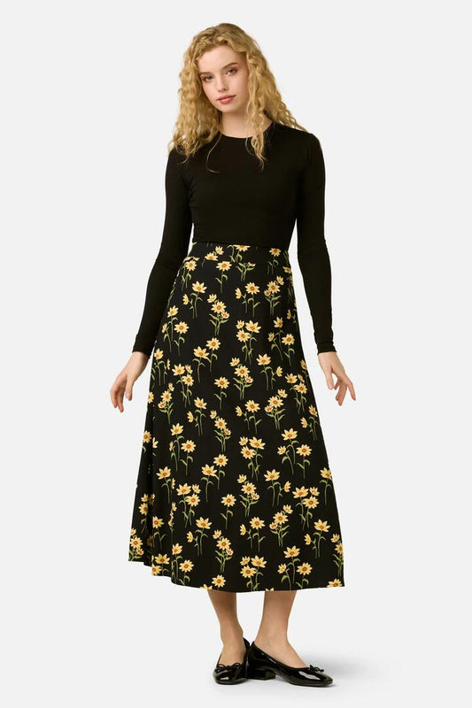 Image of a model wearing Skirts. Product name - Goldie Daisy Midi Skirt in Black colour by brand - Princess Highway