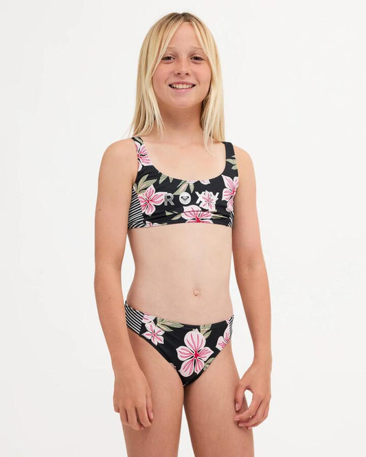 Image of a model wearing Tops. Product name - Roxy Girls 8-16 Of The Pacific Bralette Two Piece Prism Pink in Prism Pink colour by brand - Roxy