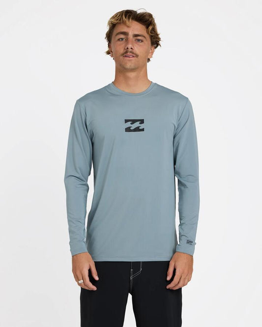 Image of a model wearing Tops. Product name - Billabong Mens All Day Wave Lf Long Sleeve Surf Shirt Blue Fog in Blue Fog colour by brand - Billabong