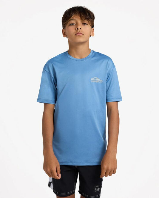 Image of a model wearing Tops. Product name - Quiksilver Boys 8-16 Carbon Short Sleeve Rashguard Quiet Harbor in Quiet Harbor colour by brand - Quiksilver