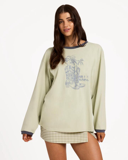Image of a model wearing Tops. Product name - Billabong Womens Cowgirl Long Sleeve T-Shirt Smoke Green in Smoke Green colour by brand - Billabong