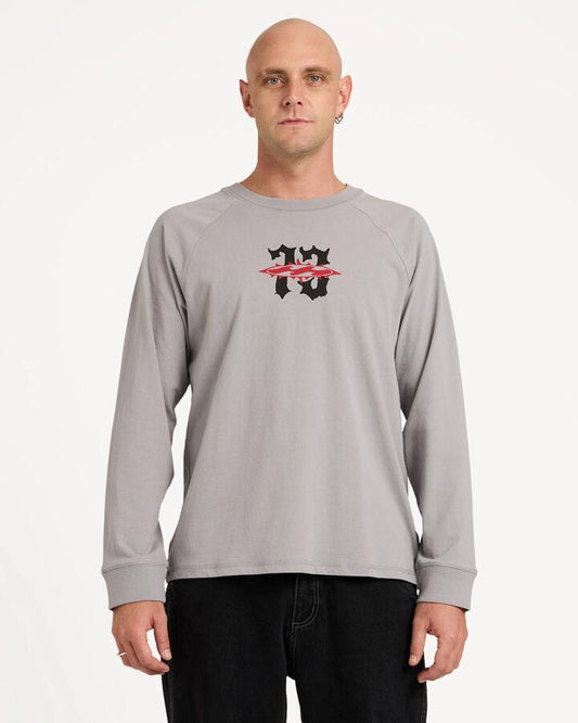 Image of a model wearing Tops. Product name - Billabong Mens Creed Odyssey Long Sleeve T-Shirt Alloy in Alloy colour by brand - Billabong