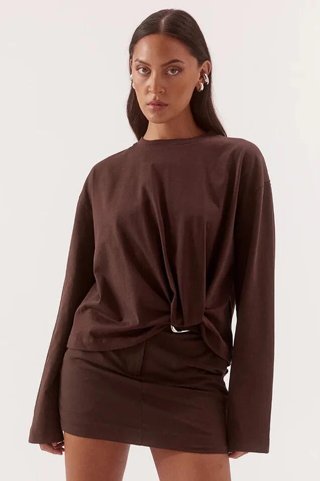Image of a model wearing Tops. Product name - Izel Espresso Twist Front LS Top in Brown colour by brand - Sovere