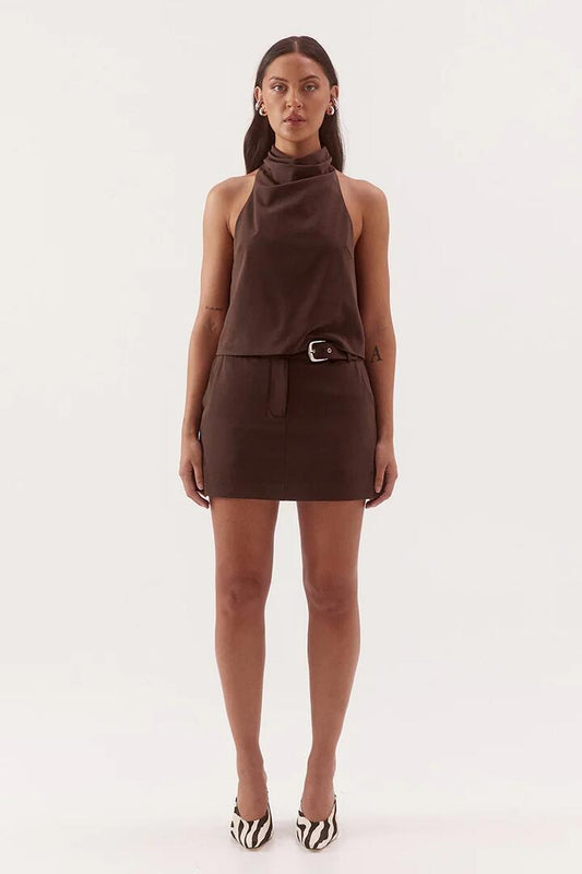 Image of a model wearing Skirts. Product name - Amorey Espresso Mini Skort in Brown colour by brand - Sovere